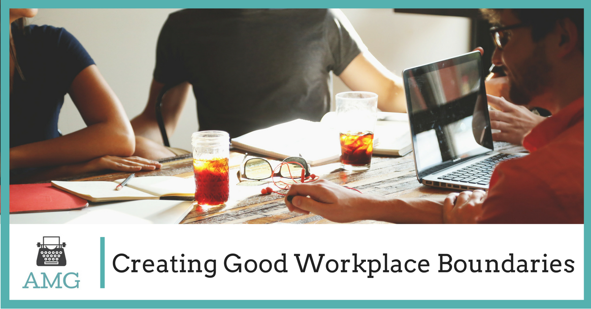Creating Good Workplace Boundaries: coworkers sharing a table with laptops and notebooks